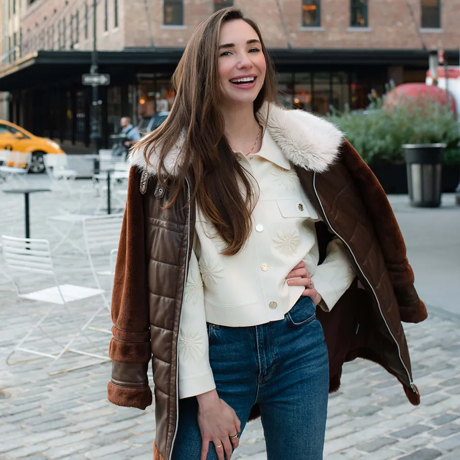 Blaine in a suede jacket, smiling, in Chelsea NYC