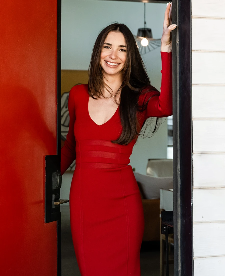 Me in a red dress in a doorway